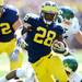 Michigan sophomore running back Fitzgerald Toussaint runs the ball  during the first half against Eastern Michigan at Michigan Stadium on Saturday. Melanie Maxwell I AnnArbor.com